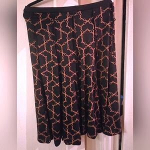 CHANEL Black Skirt with Gold Chain Design